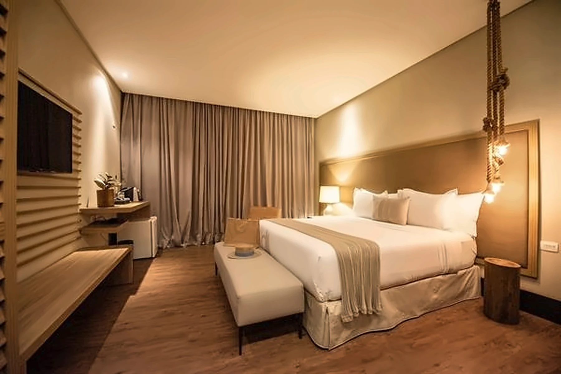 Colina Garden Suite bedroom with wood furnishings