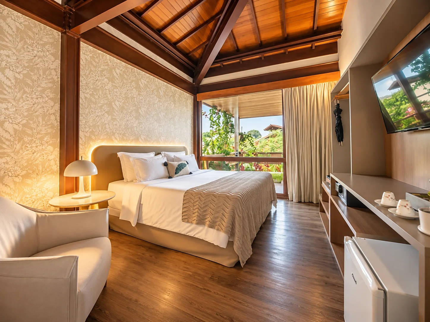 Wide view of the Standard Apartment bedroom and window at Pousada Morena