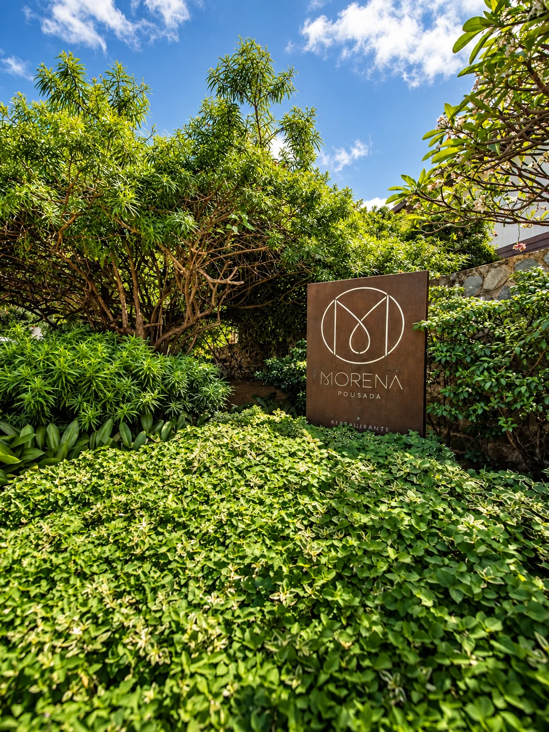 Entrance to Pousada Morena surrounded by tropical plants
